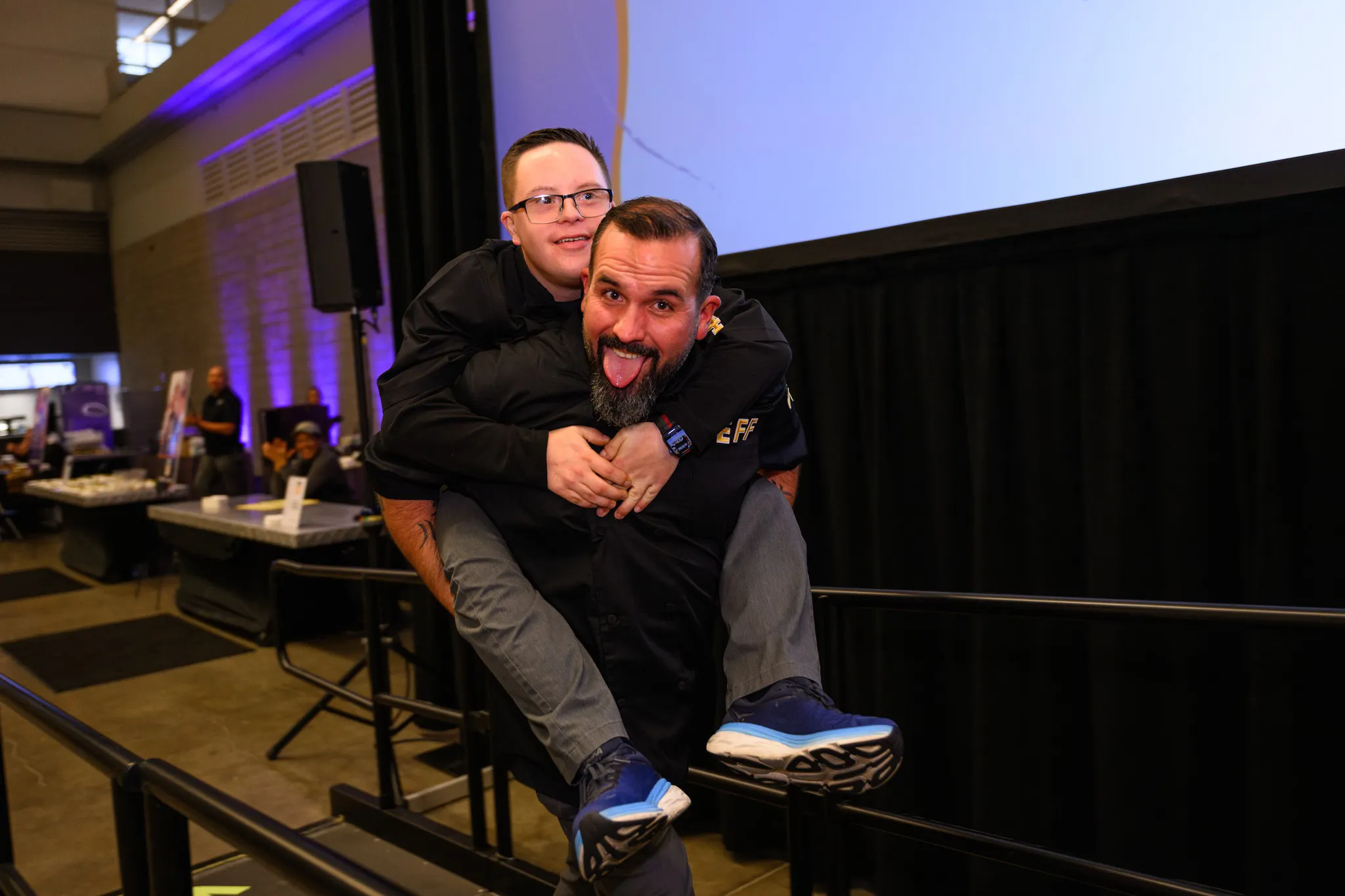 Chef carrying best buddy on his back smiling